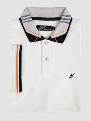 A white polo with detailed collar.