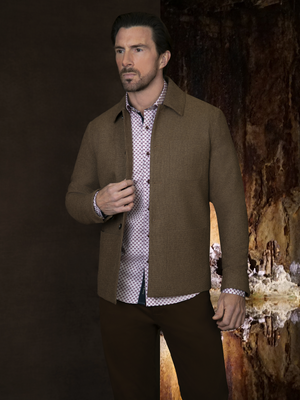 A man wearing the baltoro camel wool smart structured jacket with a bromley chino trousers.