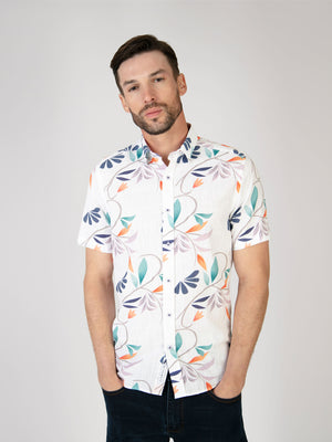 Model wearing a short sleeve floral printed shirt for the summer season.
