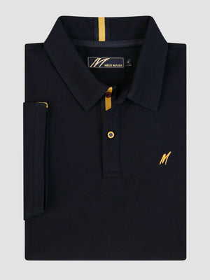 Mistral Navy short sleeve polo shirt with gold detailing and chest embroidery, folded neatly on a grey background.