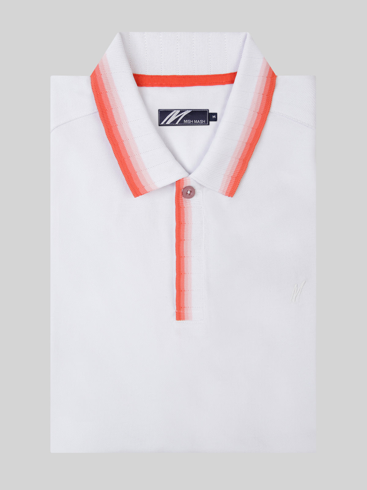 A white polo with red collar detail, designed in the UK for menswear brands. 