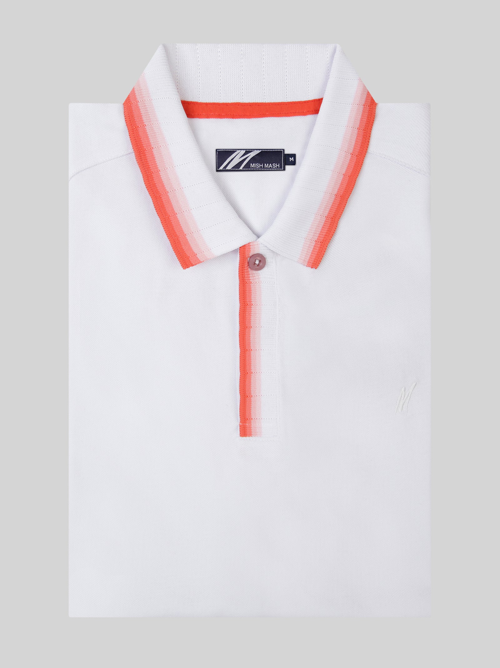 A white polo with red collar detail, designed in the UK for menswear brands. 