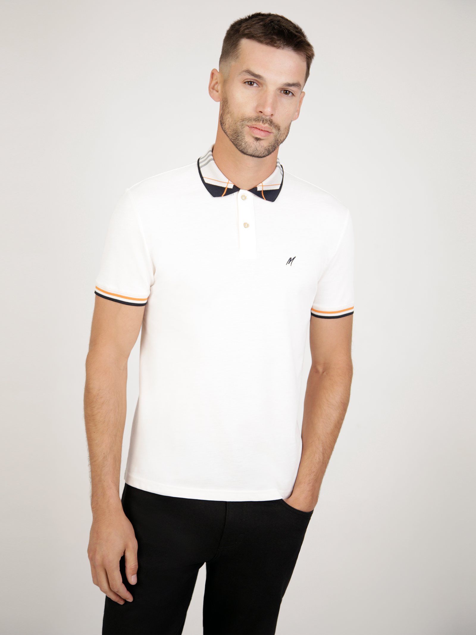 A white polo with detailed collar. 