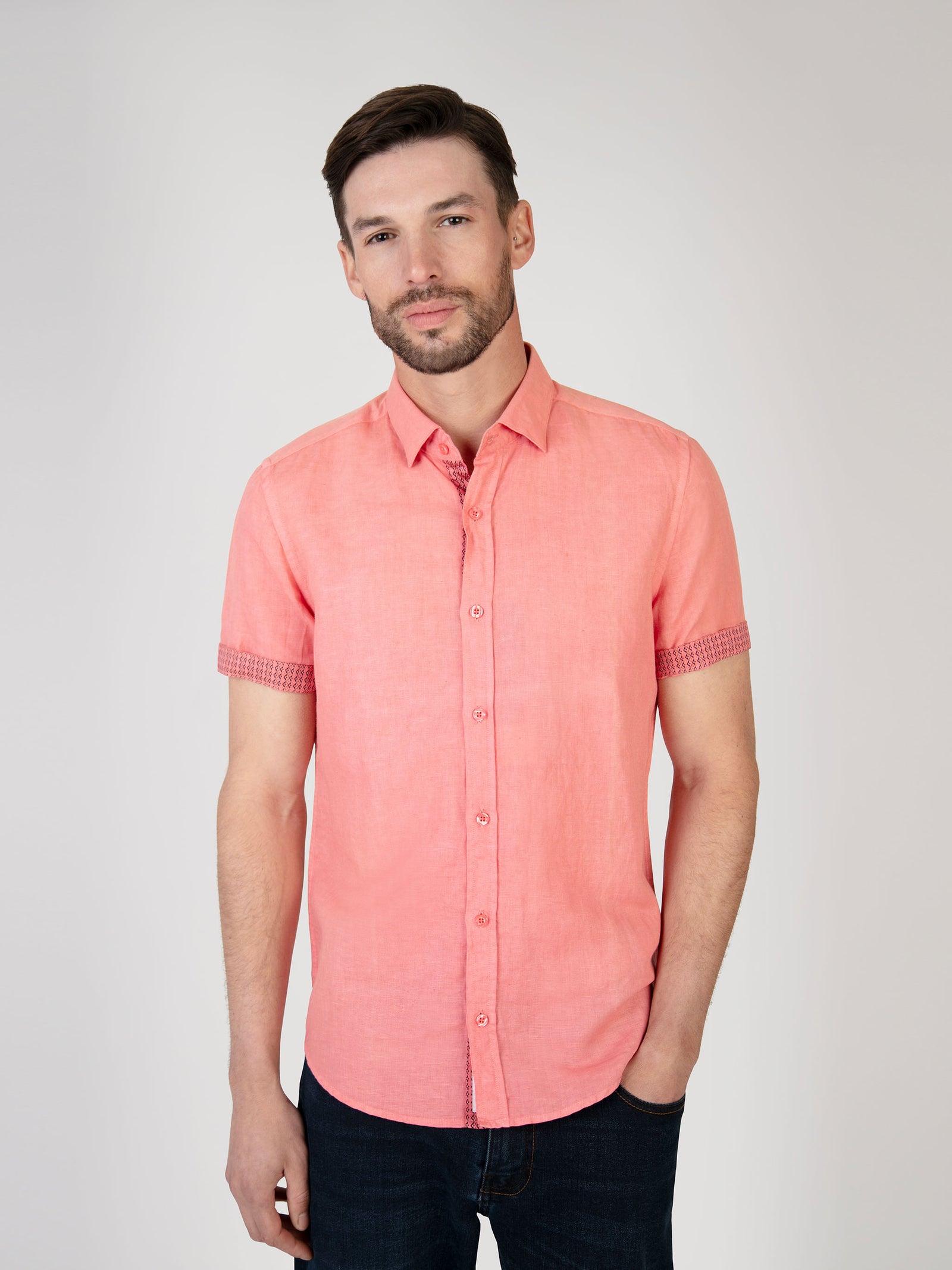 A soft red cotton linen shirt, designed in the UK for men.