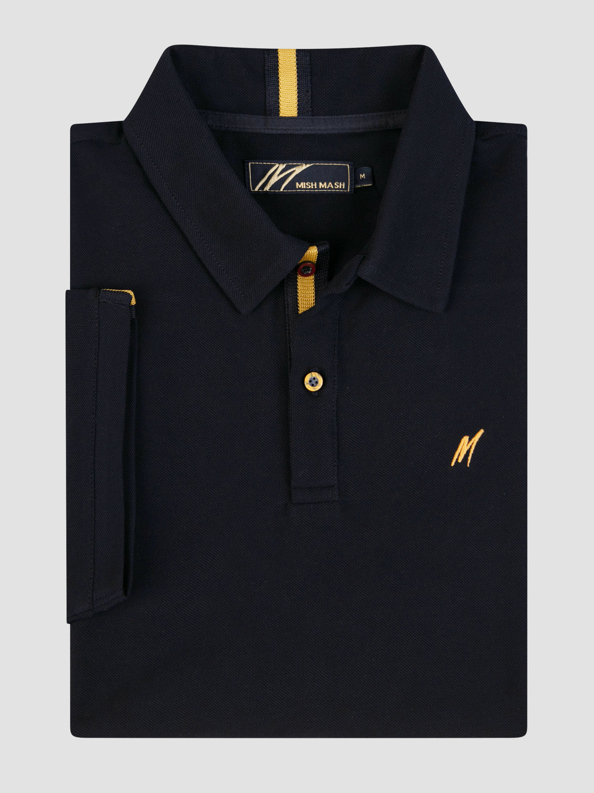 Mistral Navy short sleeve polo shirt with gold detailing and chest embroidery, folded neatly on a grey background.