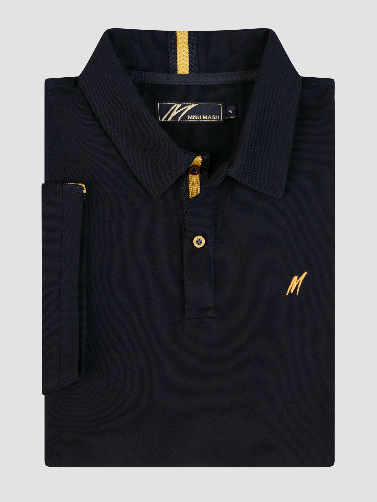 Mistral Navy short sleeve polo shirt with gold detailing and chest embroidery, folded neatly on a grey background.