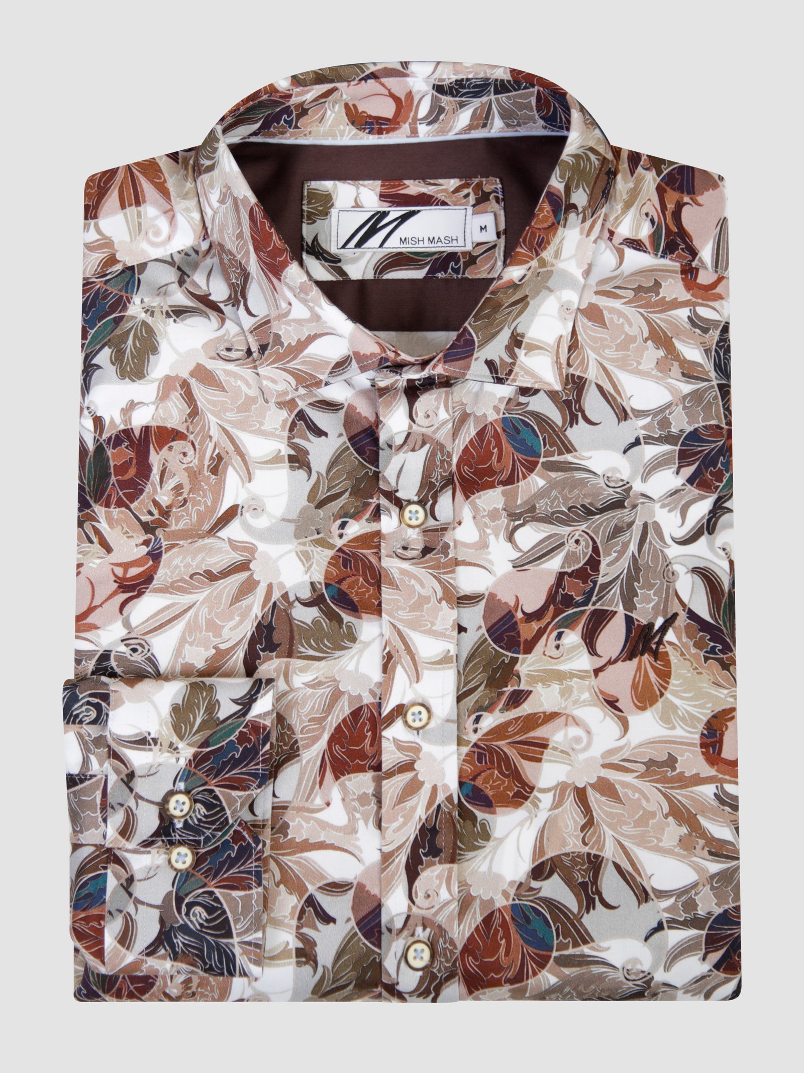 Orta stone and white long sleeve shirt with a colorful leaf pattern, folded and displayed neatly.