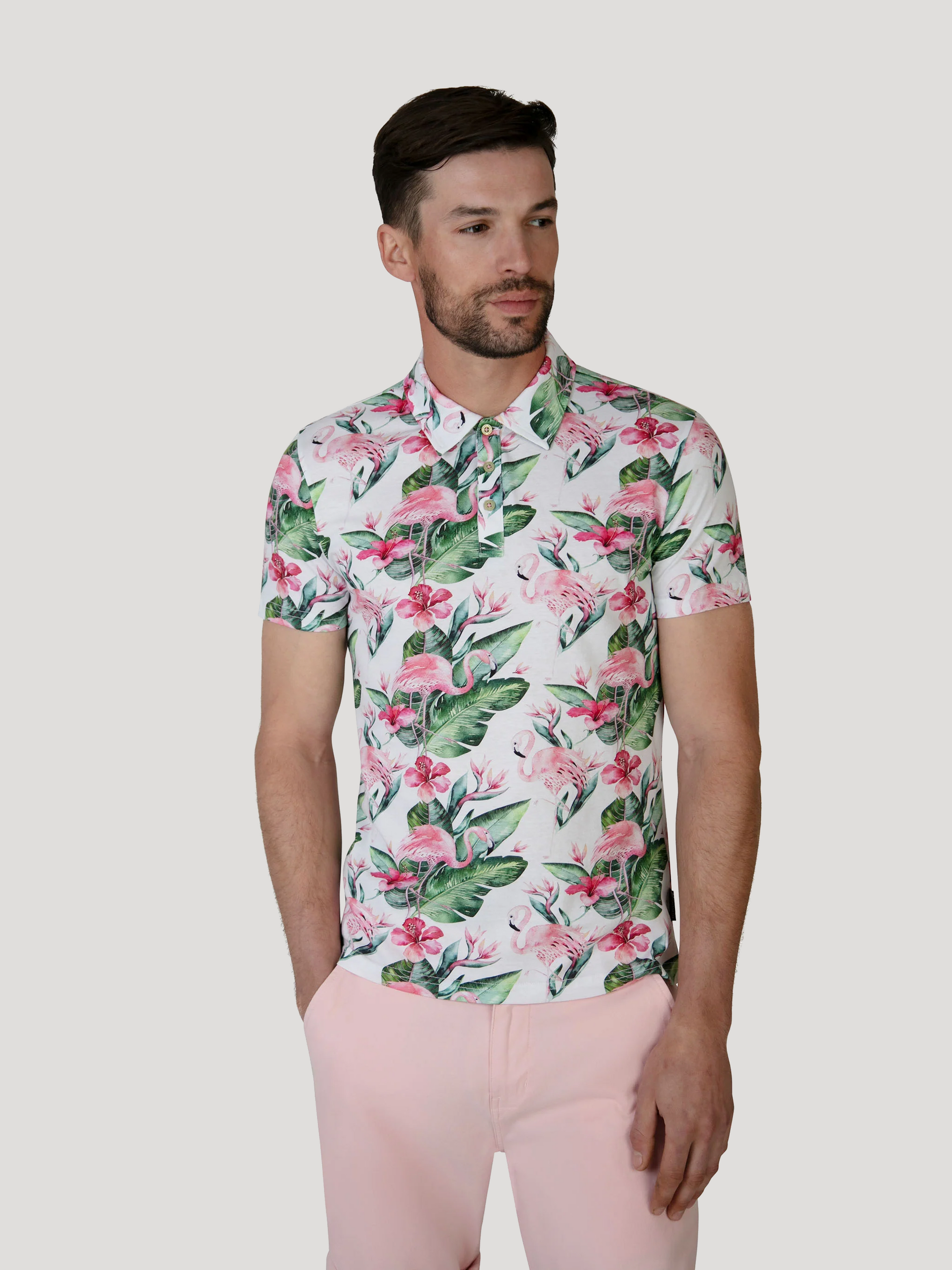 A summer floral polo in white and pink. Designed in the UK for men. 