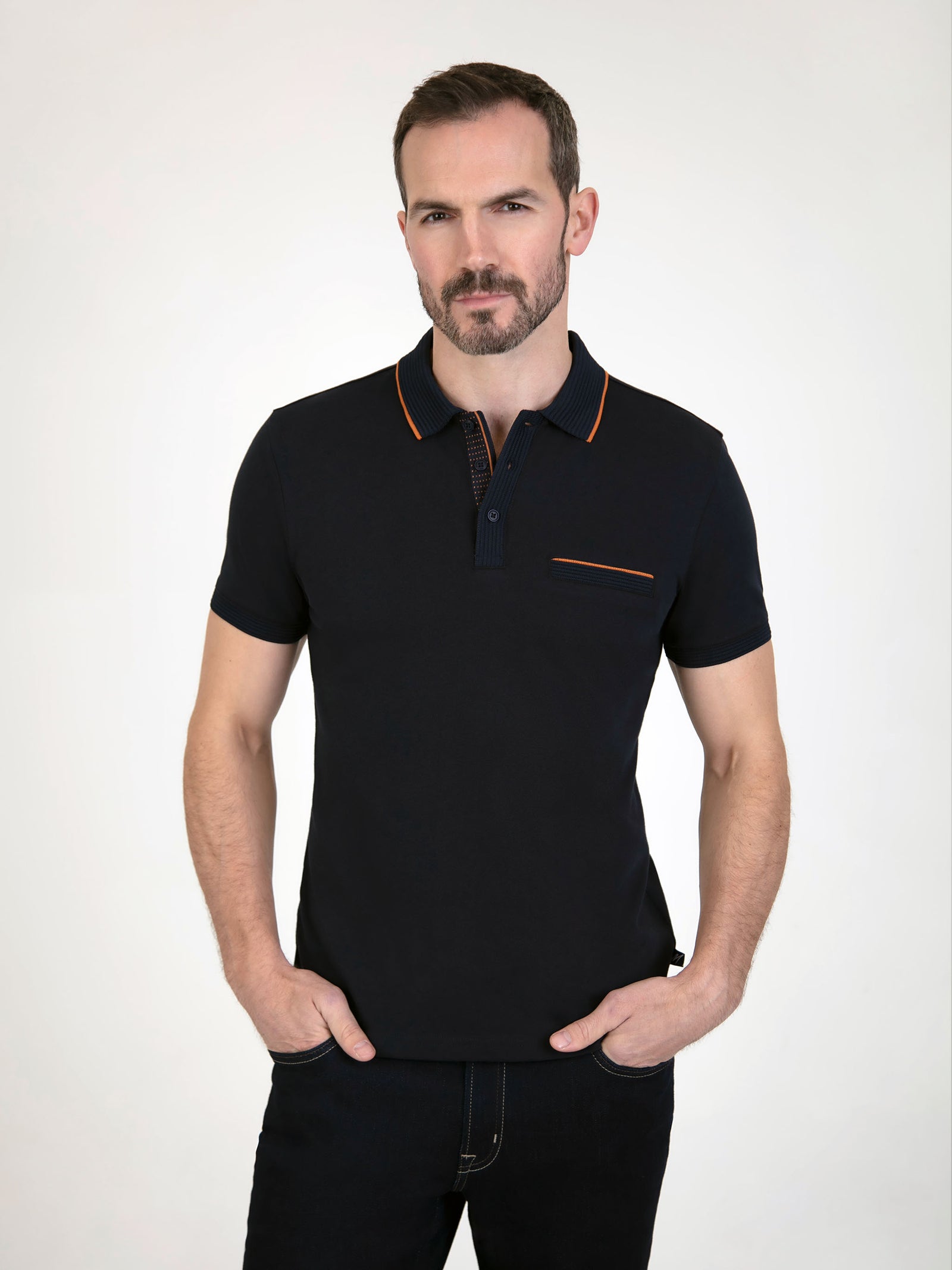 Tonto Navy short sleeve polo shirt featuring a classic collar and contrasting orange accents.