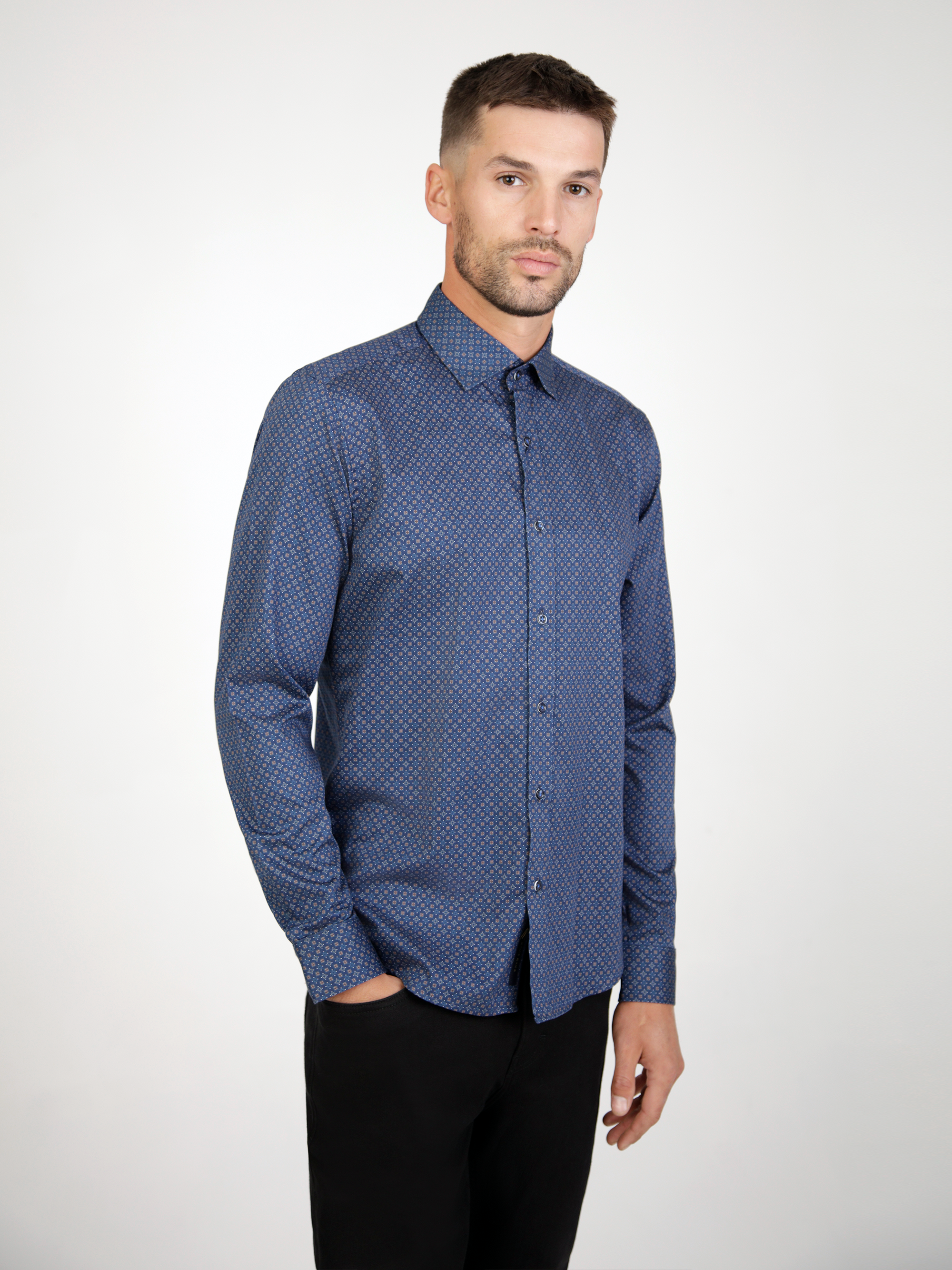 Navy long sleeve shirt with a floral pattern, folded neatly to showcase design and collar.