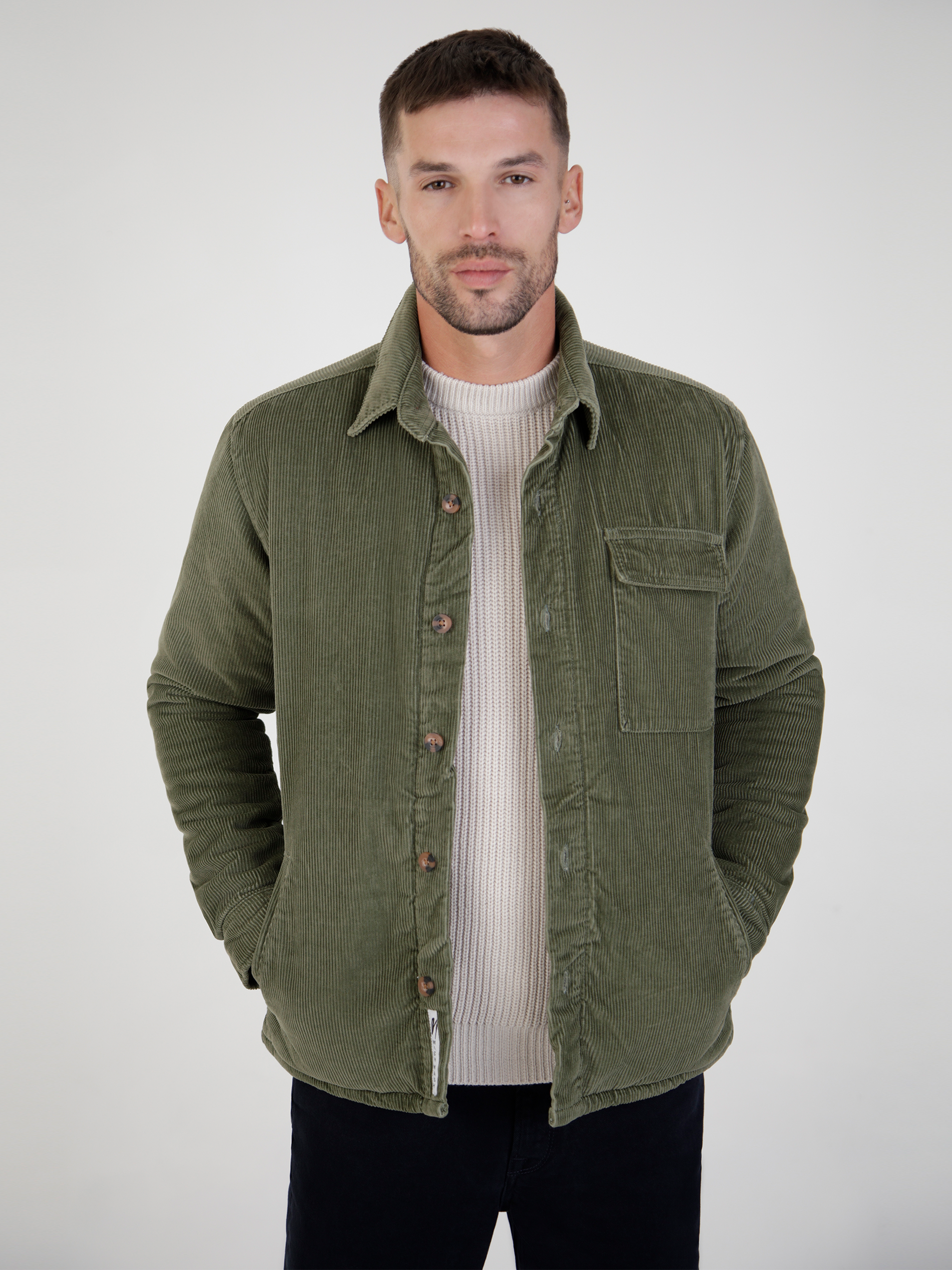 Vanguard olive cord jacket featuring button front, chest pocket, and soft 100% cotton fabric.