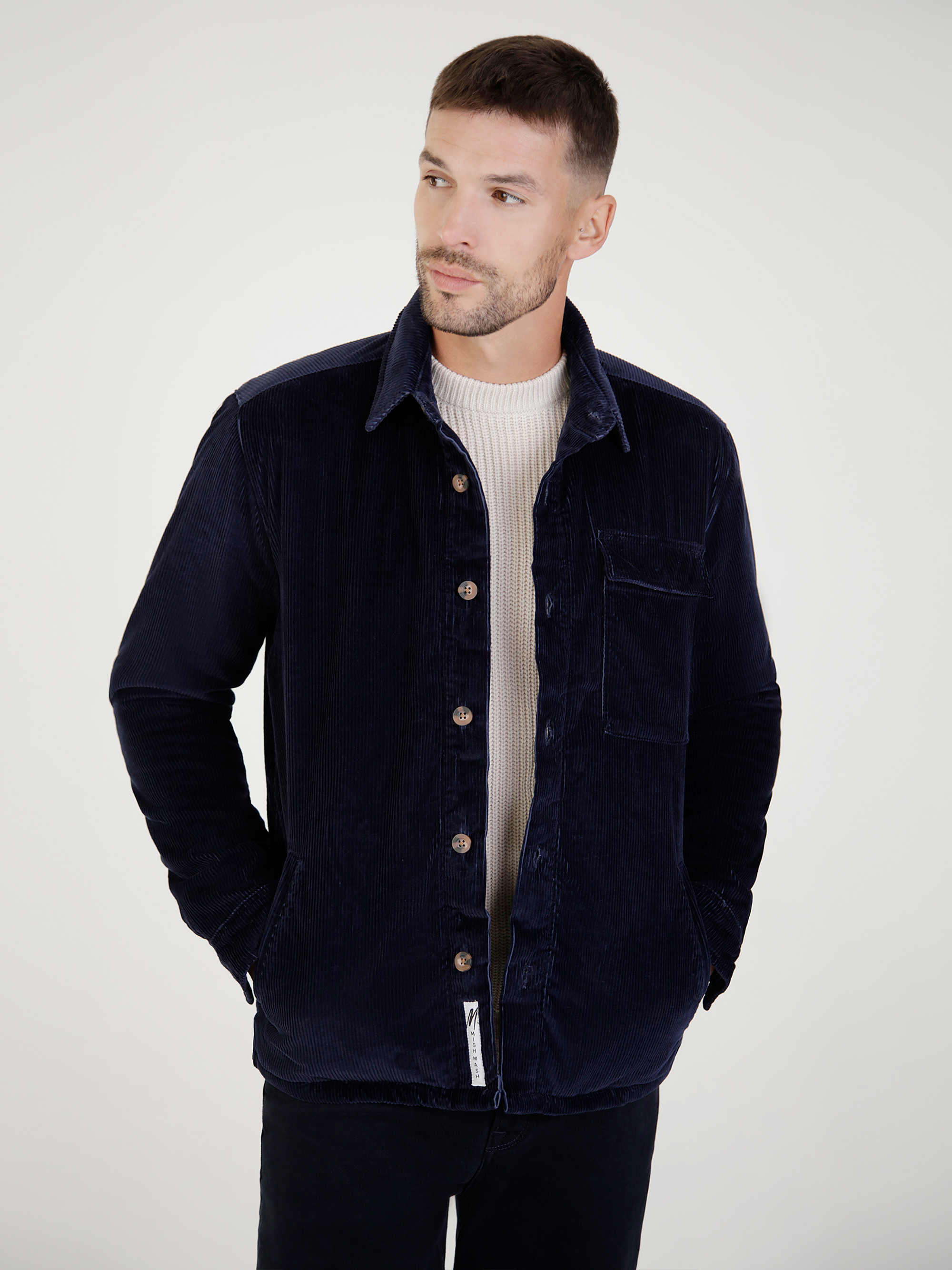 Vanguard navy cord jacket front view, lightweight with button placket and chest pocket, perfect for casual wear.